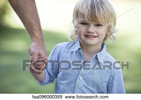 Stock Photo - Boy holding father's hand. Fotosearch