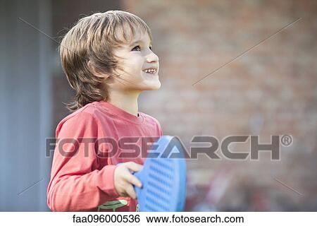 Boy holding racket View Large Photo Image Stock Photograph - Boy holding racket. Fotosearch