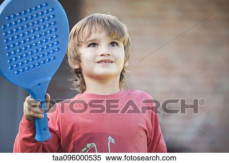 Boy holding racket View Large Photo Image Stock Photography - Boy holding racket. Fotosearch