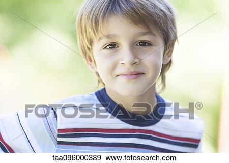 Boy in striped shirt, portrait View Large Photo Image Stock Photo - Boy in striped shirt, portrait. Fotosearch