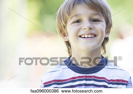 Boy in striped shirt, portrait View Large Photo Image Stock Photograph - Boy in striped shirt, portrait. Fotosearch