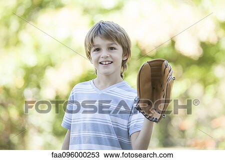 Stock Image - Boy wearing baseball glove. Fotosearch
