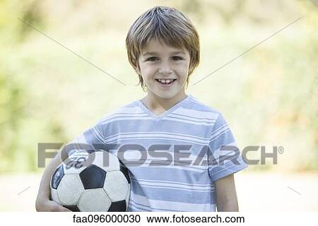 Boy with soccer ball, portrait View Large Photo Image Stock Image - Boy with soccer ball, portrait. Fotosearch