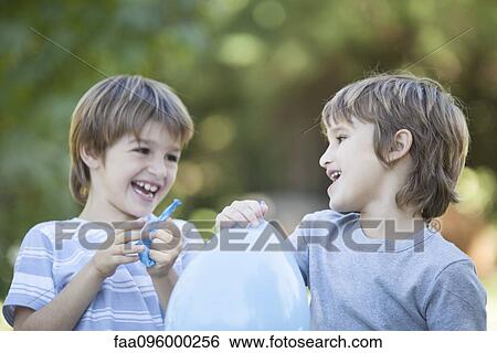Stock Photograph - Boys with balloons. Fotosearch