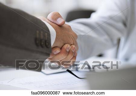 Business deal closed with handshake View Large Photo Image Stock Photo - Business deal closed with handshake. Fotosearch