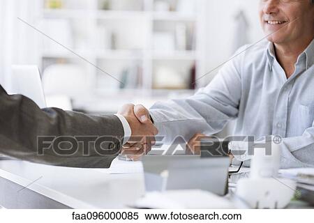 Businessmen shaking hands View Large Photo Image Stock Photography - Businessmen shaking hands. Fotosearch