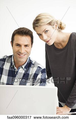 Colleagues collaborating on work project View Large Photo Image Stock Photo - Colleagues collaborating on work project. Fotosearch