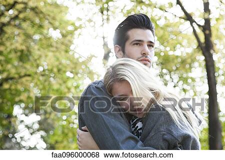 Couple embracing outdoors View Large Photo Image Stock Photo - Couple embracing outdoors. Fotosearch