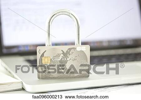 Credit card and lock resting on top of laptop computer representing internet security View Large Photo Image Stock Image - Credit card and lock resting on top of laptop computer representing internet security. Fotosearch