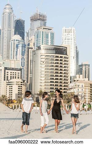 Family walking together on beach, Dubai, United Arab Emirates View Large Photo Image Stock Image - Family walking together on beach, Dubai, United Arab Emirates. Fotosearch