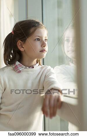 Stock Photo - Girl looking out window. Fotosearch