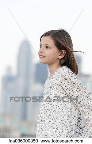 Girl outdoors, looking away in thought, portrait View Large Photo Image Stock Image - Girl outdoors, looking away in thought, portrait. Fotosearch