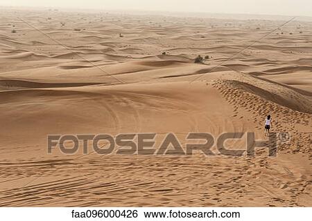 Girl running in desert View Large Photo Image Stock Photograph - Girl running in desert. Fotosearch