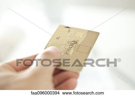 Hand holding credit card View Large Photo Image Picture - Hand holding credit card. Fotosearch