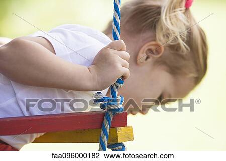 Little girl on jungle gym View Large Photo Image Stock Image - Little girl on jungle gym. Fotosearch