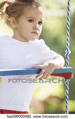 Little girl on jungle gym View Large Photo Image Stock Image - Little girl on jungle gym. Fotosearch