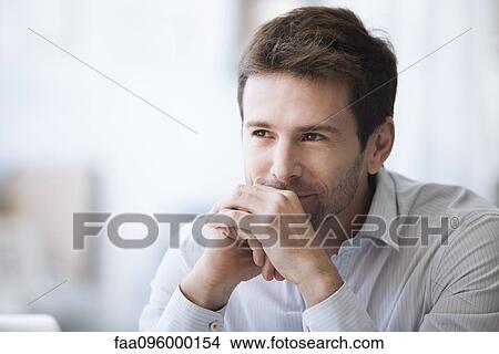 Mid-adult man in thought, portrait View Large Photo Image Picture - Mid-adult man in thought, portrait. Fotosearch
