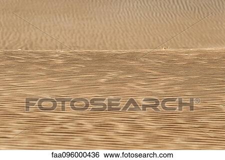 Rippled sand in desert, full frame View Large Photo Image Stock Photograph - Rippled sand in desert, full frame. Fotosearch