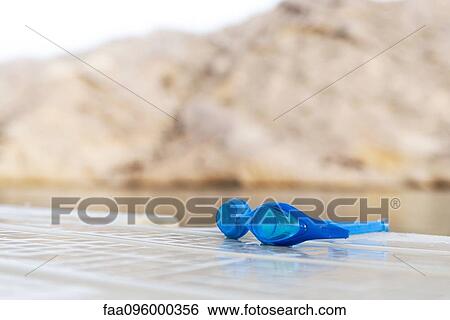 Swim goggles on dock View Large Photo Image Stock Photograph - Swim goggles on dock. Fotosearch