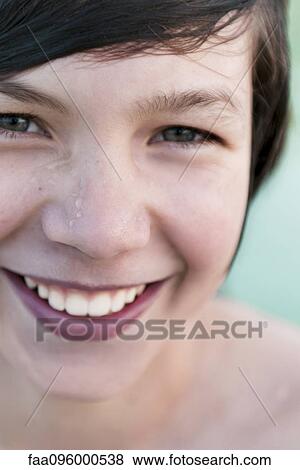 Teenage boy smiling cheerfully, portrait View Large Photo Image Stock Photo - Teenage boy smiling cheerfully, portrait. Fotosearch