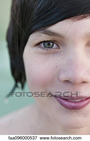 Stock Photo - Teenage boy with wet hair, close-up portrait. Fotosearch