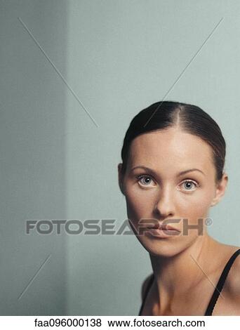 Stock Photo - Woman looking at camera, portrait. Fotosearch