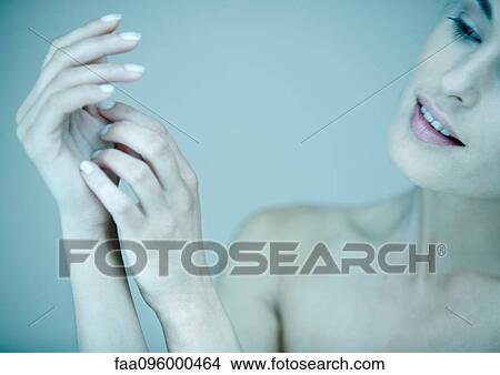 Woman, looking at hands, portrait View Large Photo Image Picture - Woman, looking at hands, portrait. Fotosearch