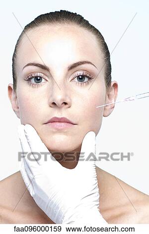 Woman receiving collagen injection View Large Photo Image Stock Photo - Woman receiving collagen injection. Fotosearch