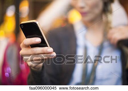 Woman taking selfie with smartphone View Large Photo Image Stock Photography - Woman taking selfie with smartphone. Fotosearch