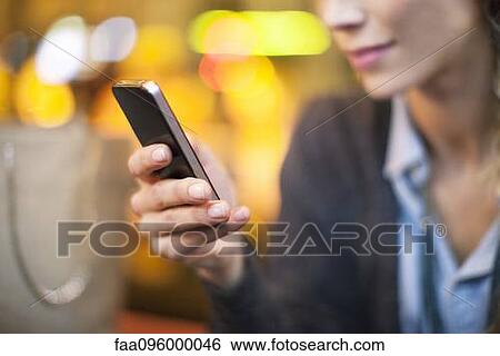 Woman using smartphone View Large Photo Image Stock Photograph - Woman using smartphone. Fotosearch