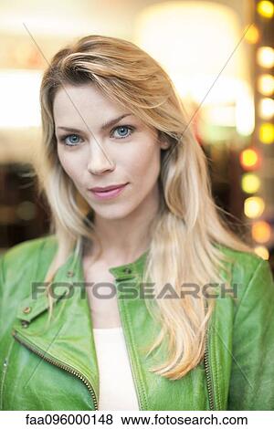 Woman wearing green leather jacket, portrait View Large Photo Image Stock Photo - Woman wearing green leather jacket, portrait. Fotosearch