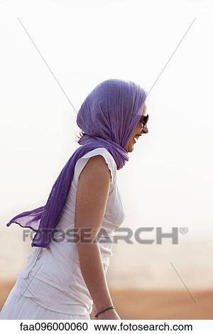 Woman wearing headscarf and sunglasses View Large Photo Image Stock Image - Woman wearing headscarf and sunglasses. Fotosearch