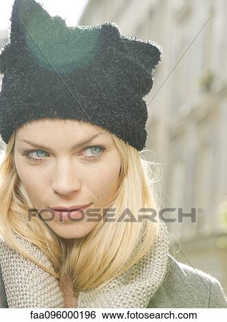 Woman wearing knit hat and scarf, portrait View Large Photo Image Stock Photograph - Woman wearing knit hat and scarf, portrait. Fotosearch