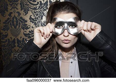 Woman wearing party mask, portrait View Large Photo Image Stock Photo - Woman wearing party mask, portrait. Fotosearch