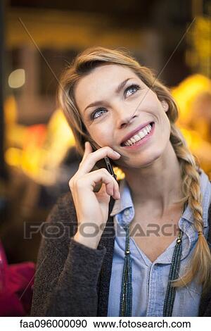 Woman with cell phone making phone call View Large Photo Image Stock Image - Woman with cell phone making phone call. Fotosearch