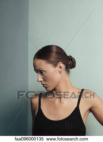 Woman with hair in bun, portrait View Large Photo Image Stock Photography - Woman with hair in bun, portrait. Fotosearch
