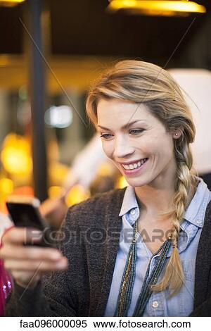 Woman with smartphone taking photograph View Large Photo Image Stock Photography - Woman with smartphone taking photograph. Fotosearch