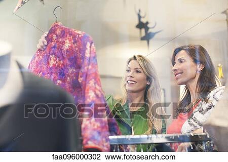 Women shopping in clothing retail store View Large Photo Image Stock Image - Women shopping in clothing retail store. Fotosearch