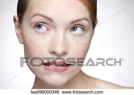 Young woman biting lips View Large Photo Image Stock Photograph - Young woman biting lips. Fotosearch