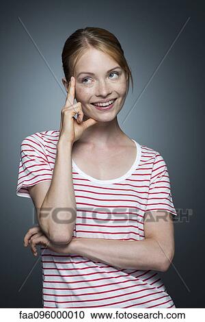 Young woman daydreaming View Large Photo Image Stock Image - Young woman daydreaming. Fotosearch