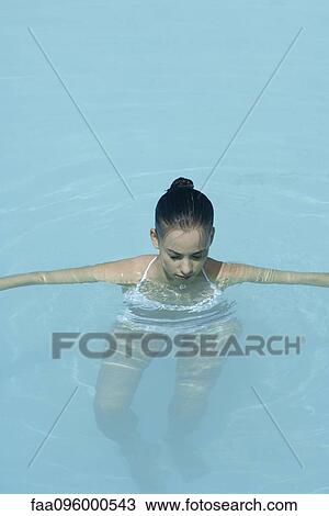 Young woman in swimming pool, eyes closed View Large Photo Image Stock Image - Young woman in swimming pool, eyes closed. Fotosearch