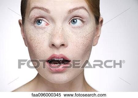 Stock Photography - Young woman with look of surprise. Fotosearch