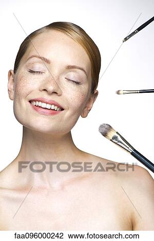 Young woman with make-up brushes View Large Photo Image Stock Image - Young woman with make-up brushes. Fotosearch