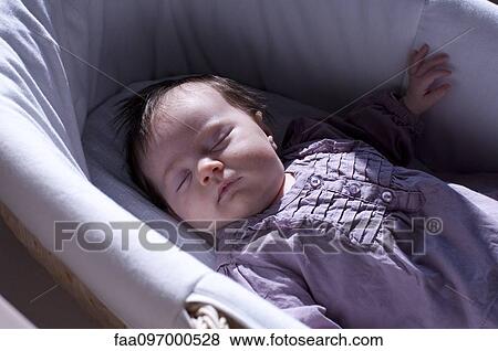 Stock Photo - Baby sleeping in crib. Fotosearch