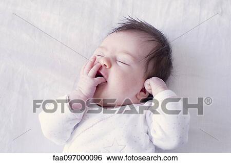 Baby yawning View Large Photo Image Stock Photograph - Baby yawning. Fotosearch
