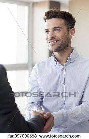 Client shaking hands with businessman View Large Photo Image Stock Photo - Client shaking hands with businessman. Fotosearch