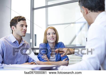 Clients meeting with advisor in office View Large Photo Image Stock Image - Clients meeting with advisor in office. Fotosearch