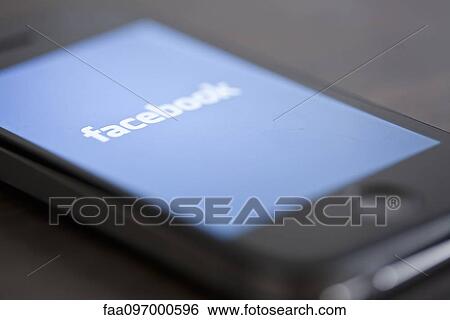 Close-up of smartphone displaying social media app View Large Photo Image Stock Photograph - Close-up of smartphone displaying social media app. Fotosearch