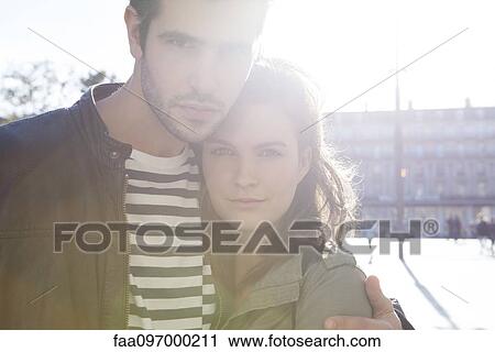Couple embracing in city, portrait View Large Photo Image Stock Image - Couple embracing in city, portrait. Fotosearch