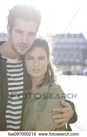 Couple embracing in city, portrait View Large Photo Image Stock Photo - Couple embracing in city, portrait. Fotosearch